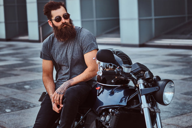 Beardsman Next to Motorcycle Wearing Sunglasses - Lucky Boy Beard Company